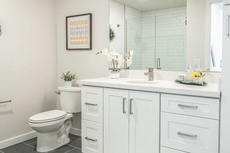bathroom remodeling white vanity and glass shower crop