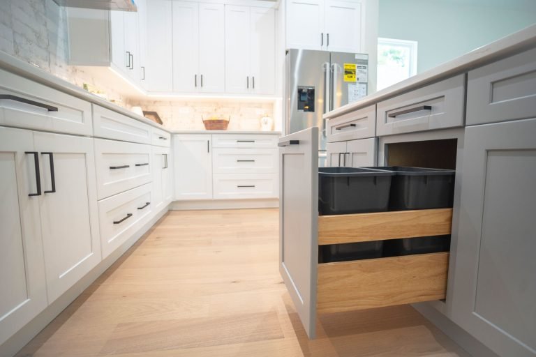 pull out trash bin in gray rta cabinet seattle