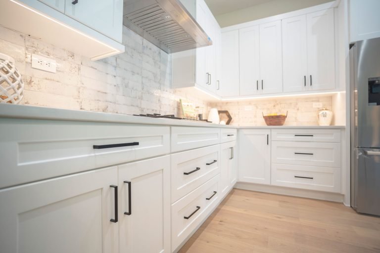 white rta cabinets brick backsplash seattle