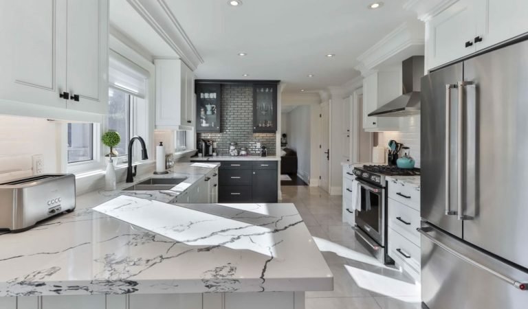 white marble framed countertop custom cabinets